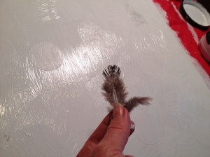 Adding feathers to painting