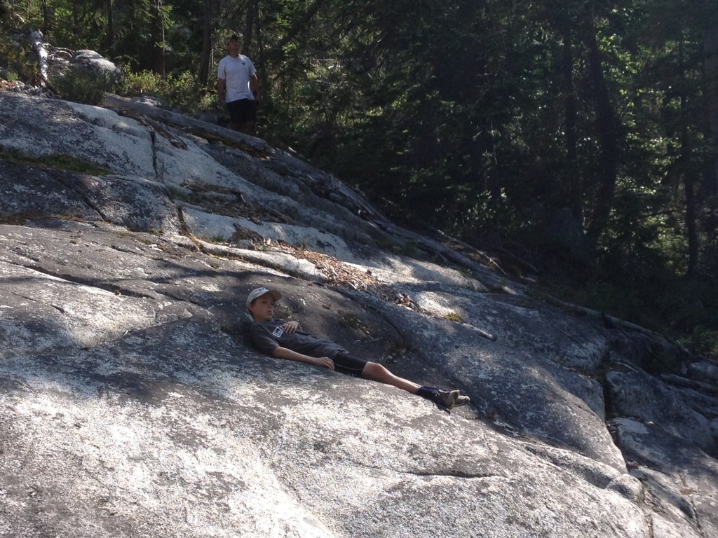 Some of us rested in the shade. Kid 3 tired out from helping me up the boulders.